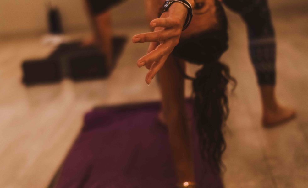 yoga student bending backwards in yoga stretch